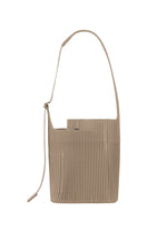 A detail shot of the Homme Plisse Issey Miyake UTILITY bag.