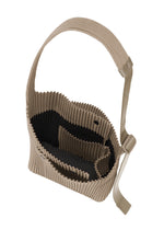 A detail shot of the Homme Plisse Issey Miyake UTILITY bag.