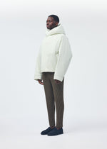 A model wears the Homme Plisse Issey Miyake DUVET COAT blouson.