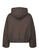 A detail shot of the Homme Plisse Issey Miyake DUVET COAT blouson.