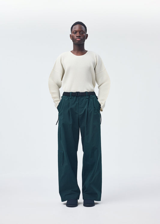 A model wears the Homme Plisse Issey Miyake QUARRY Trousers trousers.