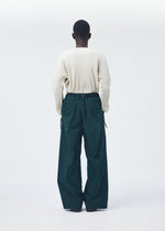 A model wears the Homme Plisse Issey Miyake QUARRY Trousers trousers.