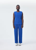 A model wears the Homme Plisse Issey Miyake KERSEY PLEATS trousers.