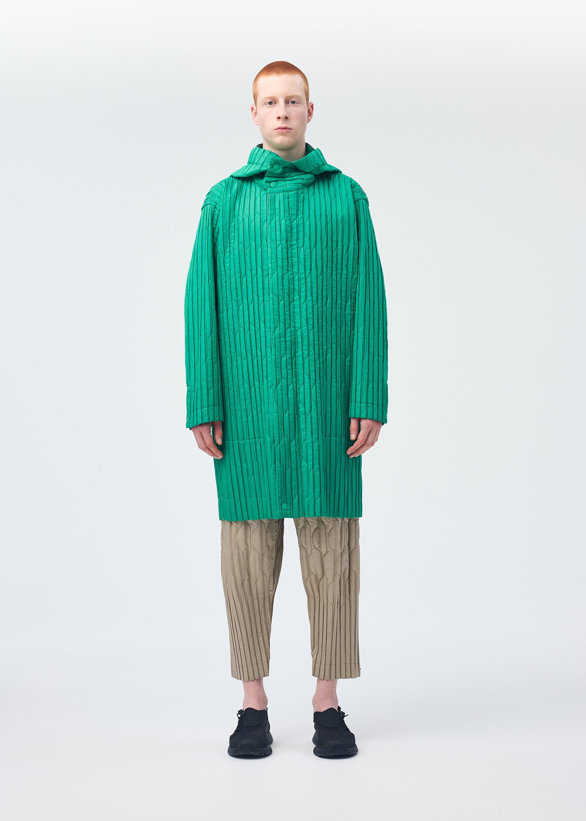 A model wears the Homme Plisse Issey Miyake PADDED PLEATS prêt à porter.