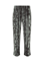 A product shot of the HOMME PLISSÉ ISSEY MIYAKE BRUSHSTROKE STRIPE trousers in black (15).