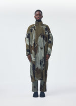 A model wears the Homme Plisse Issey Miyake PAINTED STONE coat.