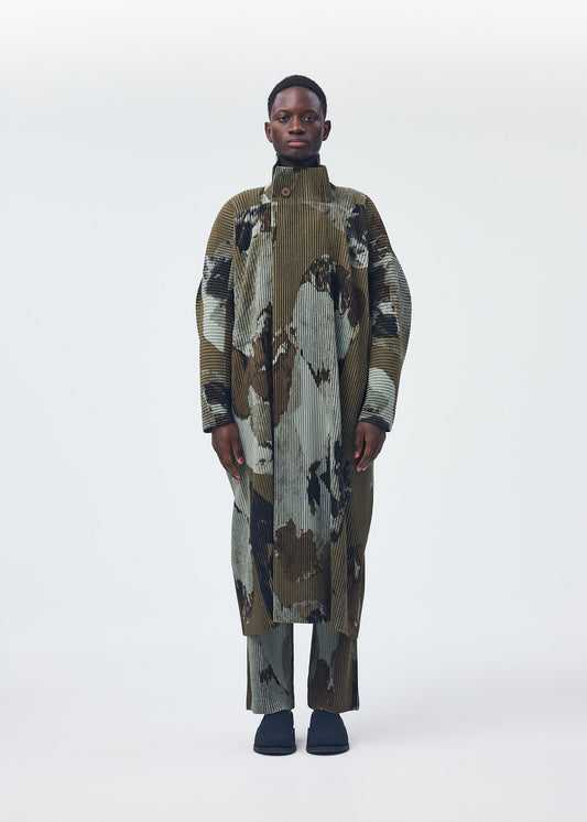 A model wears the Homme Plisse Issey Miyake PAINTED STONE coat.