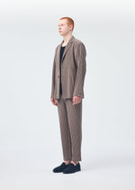 A model wears the Homme Plisse Issey Miyake TAILORED PLEATS 1 jacket.