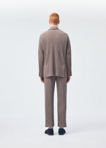 A model wears the Homme Plisse Issey Miyake TAILORED PLEATS 1 jacket.