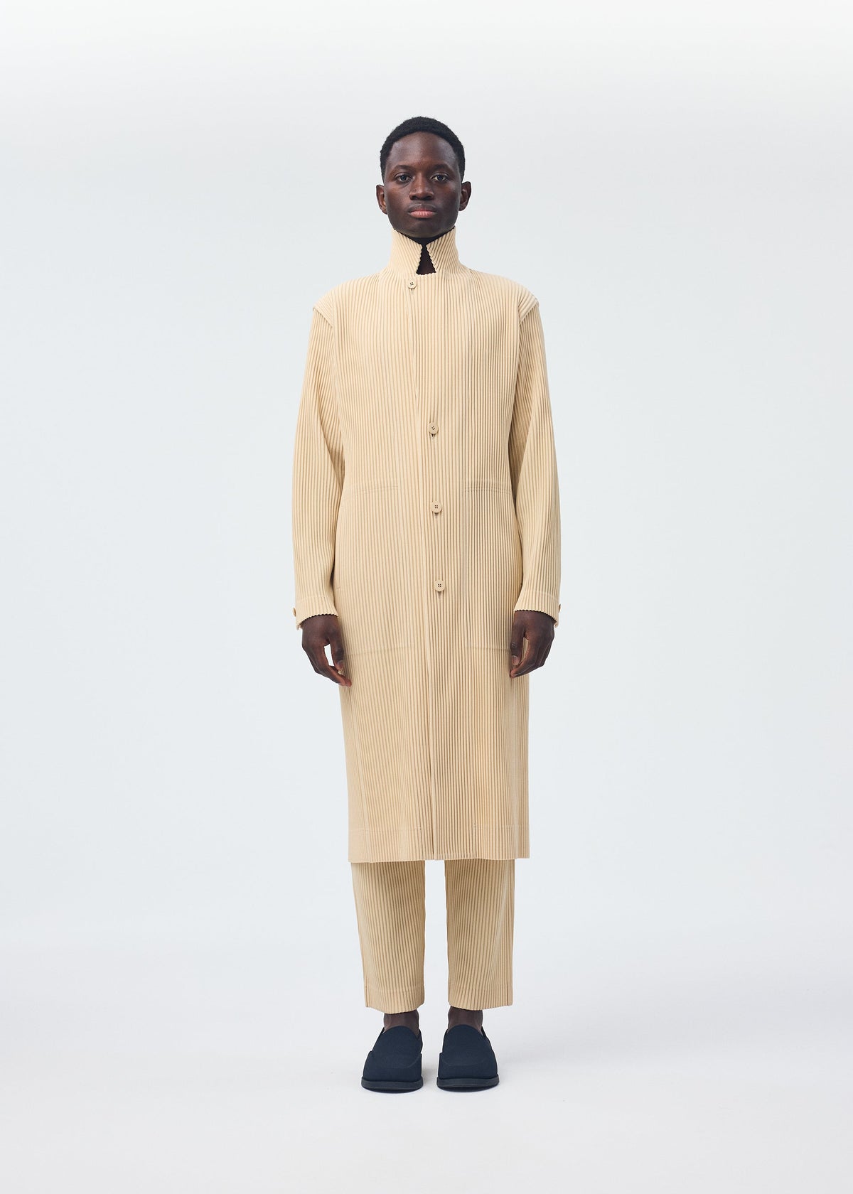 A model wears the Homme Plisse Issey Miyake TAILORED PLEATS 2 jacket.