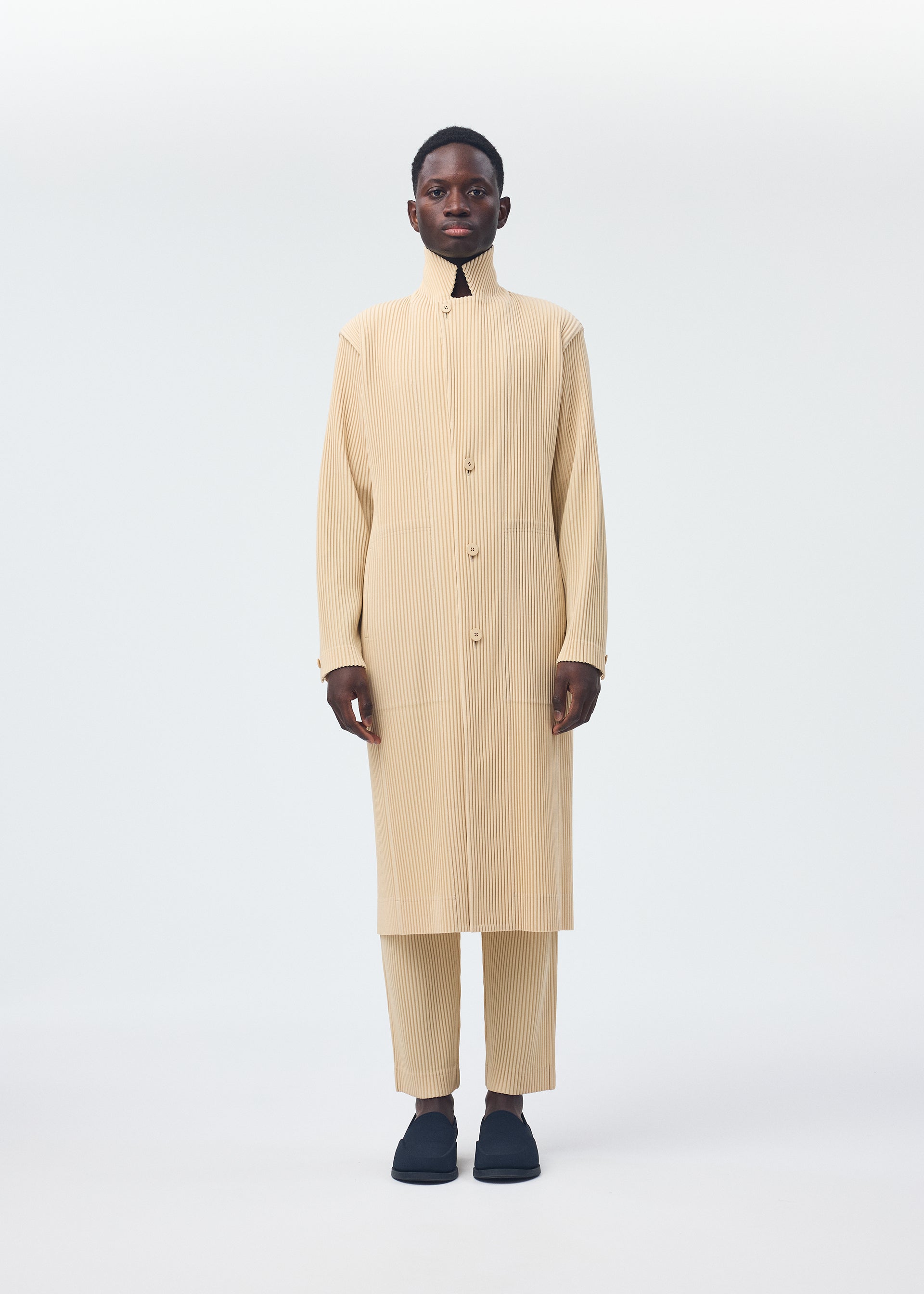 A model wears the Homme Plisse Issey Miyake TAILORED PLEATS 2 jacket.