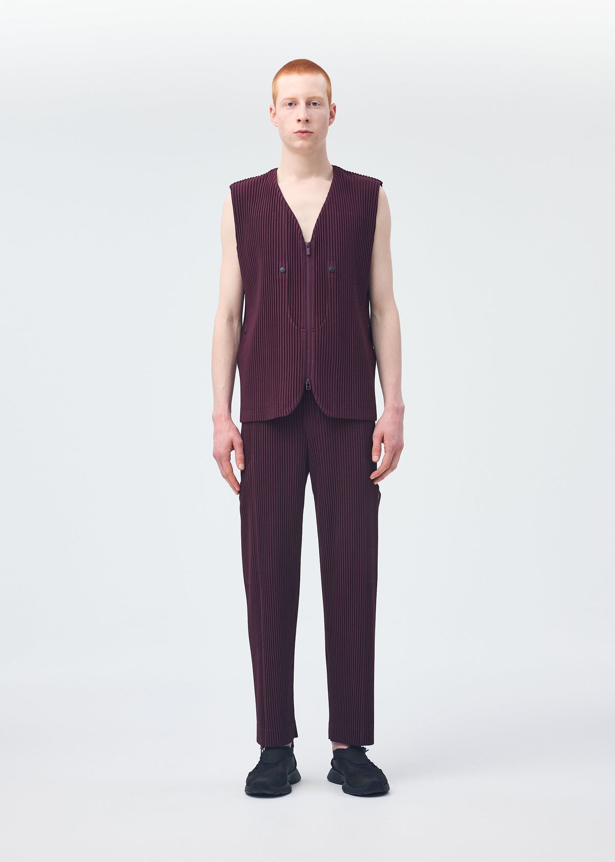 A model wears the Homme Plisse Issey Miyake QUARRY vest.
