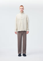 A model wears the Homme Plisse Issey Miyake MONTHLY COLORS : SEPTEMBER trousers.