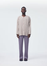 A model wears the HOMME PLISSÉ ISSEY MIYAKE PLEATS BOTTOMS 1 trousers.