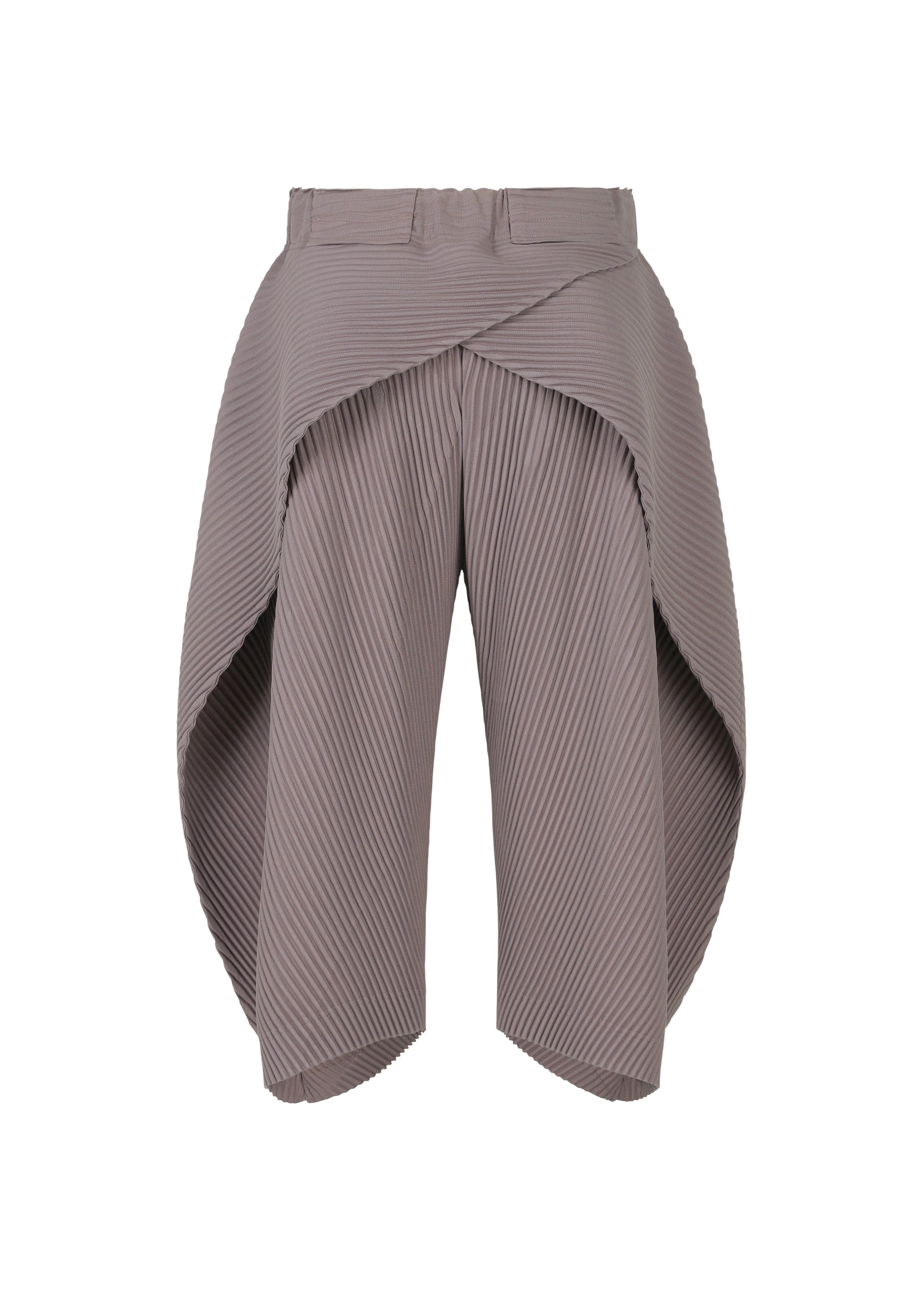 A detail shot of the HOMME PLISSÉ ISSEY MIYAKE PLEATS BOTTOMS 1 trousers.