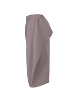 A detail shot of the HOMME PLISSÉ ISSEY MIYAKE PLEATS BOTTOMS 1 trousers.