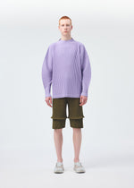 A model wears the Homme Plisse Issey Miyake PLEATS BOTTOMS 2 trousers.