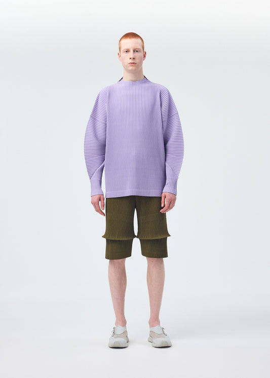 A model wears the Homme Plisse Issey Miyake PLEATS BOTTOMS 2 trousers.