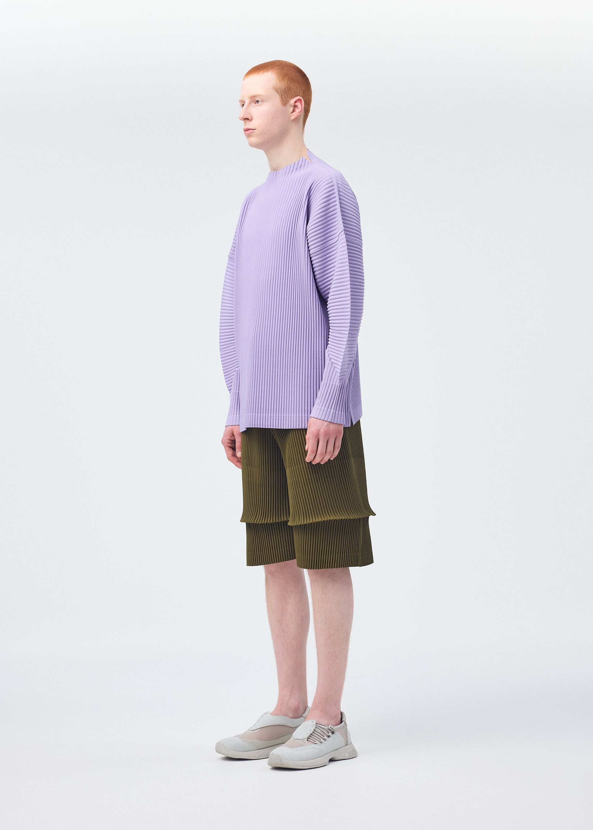 A model wears the Homme Plisse Issey Miyake PLEATS BOTTOMS 2 trousers.