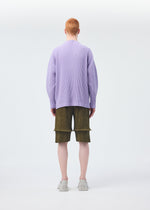 A model wears the Homme Plisse Issey Miyake PLEATS BOTTOMS 2 trousers.