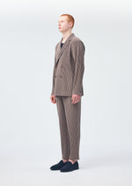 A model wears the Homme Plisse Issey Miyake TAILORED PLEATS 1 trousers.