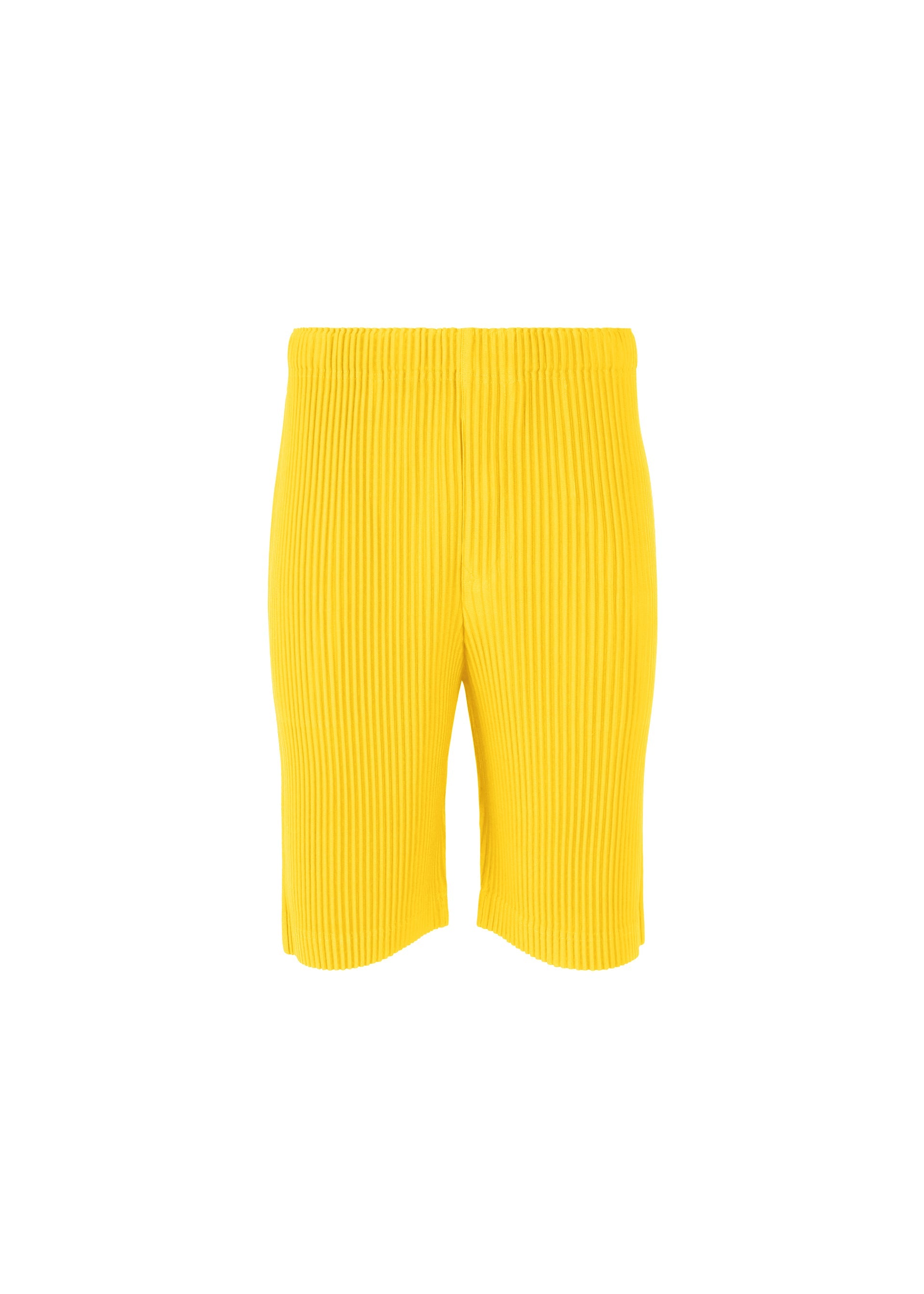 A product shot of the HOMME PLISSÉ ISSEY MIYAKE COLOR PLEATS trousers in citrine yellow (51).