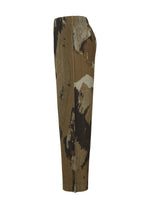 A detail shot of the Homme Plisse Issey Miyake PAINTED STONE trousers.