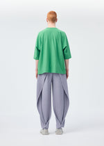A model wears the Homme Plisse Issey Miyake ANGULAR STONE trousers.