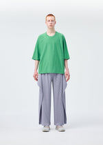 A model wears the Homme Plisse Issey Miyake ANGULAR STONE trousers.
