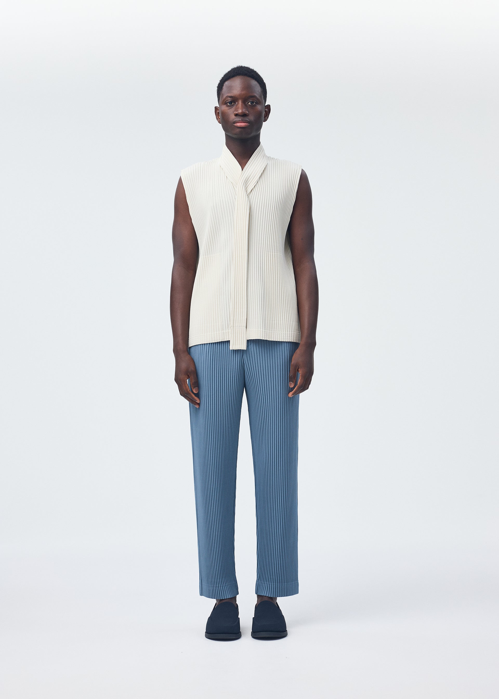 A model wears the Homme Plisse Issey Miyake MONTHLY COLORS : SEPTEMBER top.