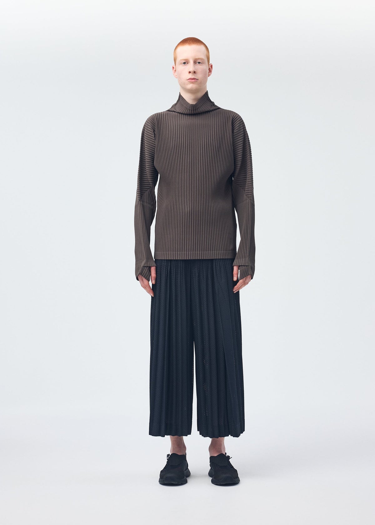 A model wears the Homme Plisse Issey Miyake MONTHLY COLORS : NOVEMBER top.