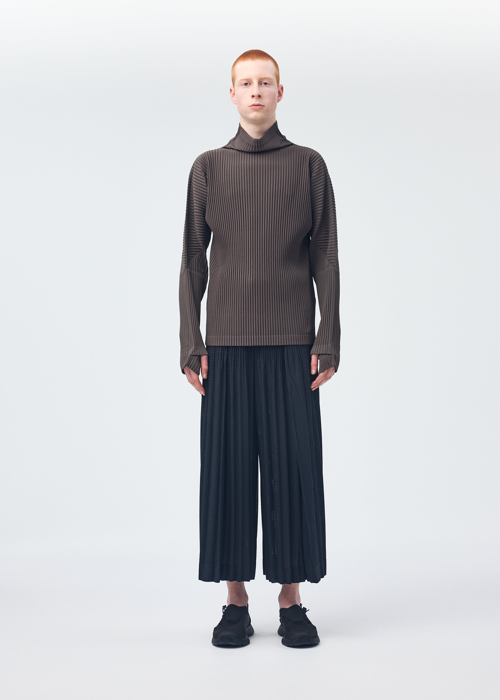 A model wears the Homme Plisse Issey Miyake MONTHLY COLORS : NOVEMBER top.