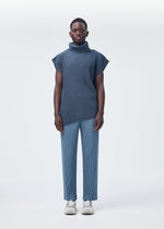 A model wears the Homme Plisse Issey Miyake ANGULAR STONE top.