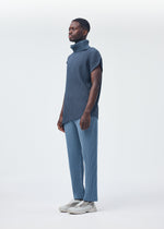 A model wears the Homme Plisse Issey Miyake ANGULAR STONE top.