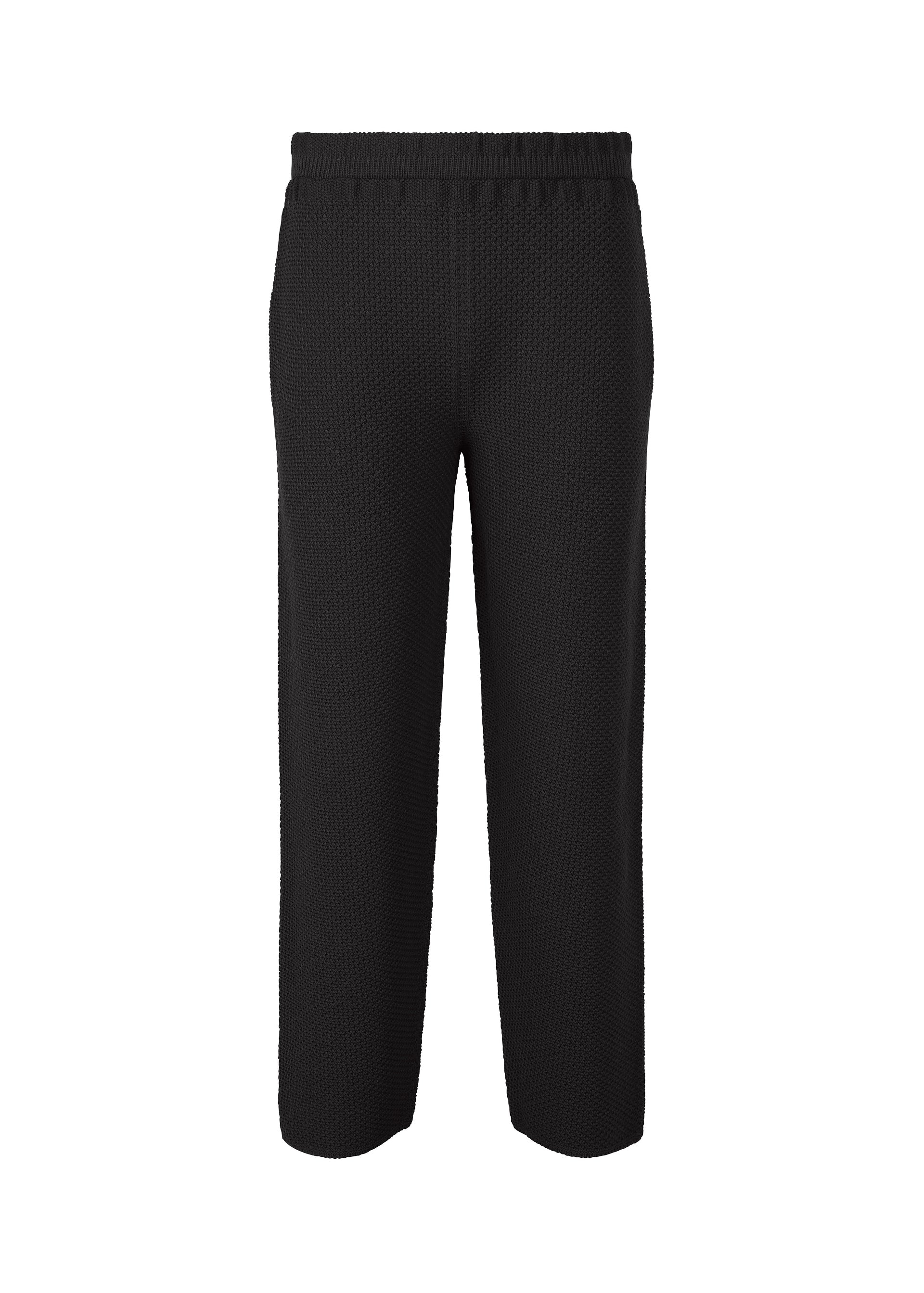 A product shot of the HOMME PLISSÉ ISSEY MIYAKE RUSTIC KNIT trousers in black (15).