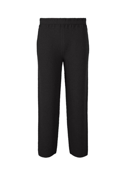 A product shot of the HOMME PLISSÉ ISSEY MIYAKE RUSTIC KNIT trousers in black (15).