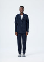A model wears the HOMME PLISSÉ ISSEY MIYAKE BASICS basics-jacket-light-grey-fw26.