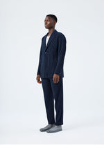 A model wears the HOMME PLISSÉ ISSEY MIYAKE BASICS basics-jacket-light-grey-fw26.