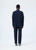 A model wears the HOMME PLISSÉ ISSEY MIYAKE BASICS basics-jacket-navy-2-fw26.