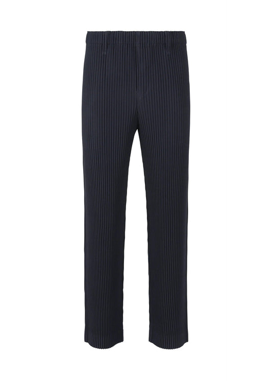 A product shot of the HOMME PLISSÉ ISSEY MIYAKE BASICS trousers in navy.