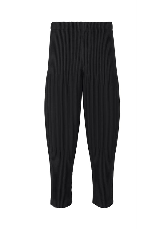 A product shot of the HOMME PLISSÉ ISSEY MIYAKE BASICS trousers in black.