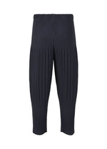 A detail shot of the HOMME PLISSÉ ISSEY MIYAKE BASICS trousers.