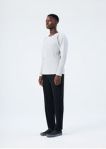 A model wears the HOMME PLISSÉ ISSEY MIYAKE BASICS basics-shirt-black-fw26.