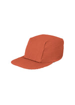 A product shot of the Homme Plisse Issey Miyake PLEATS CAP cap in jambon pink (23), recurring_style.