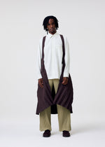 A model wears the HOMME PLISSE ISSEY MIYAKE EDGE COAT LIGHT prêt à porter.