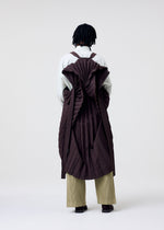 A model wears the HOMME PLISSE ISSEY MIYAKE EDGE COAT LIGHT prêt à porter.