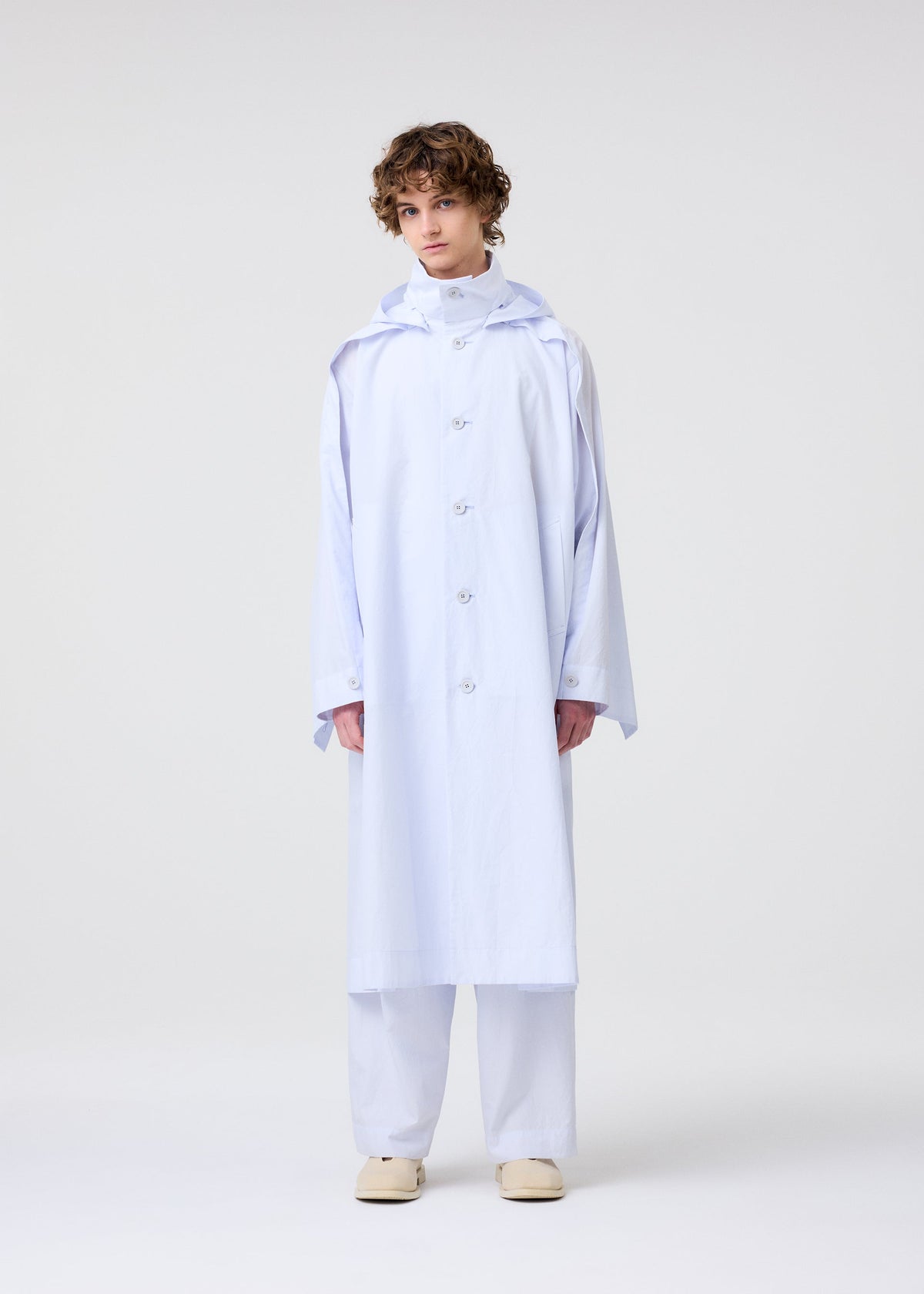 A model wears the Homme Plisse Issey Miyake FRESHEN coat.