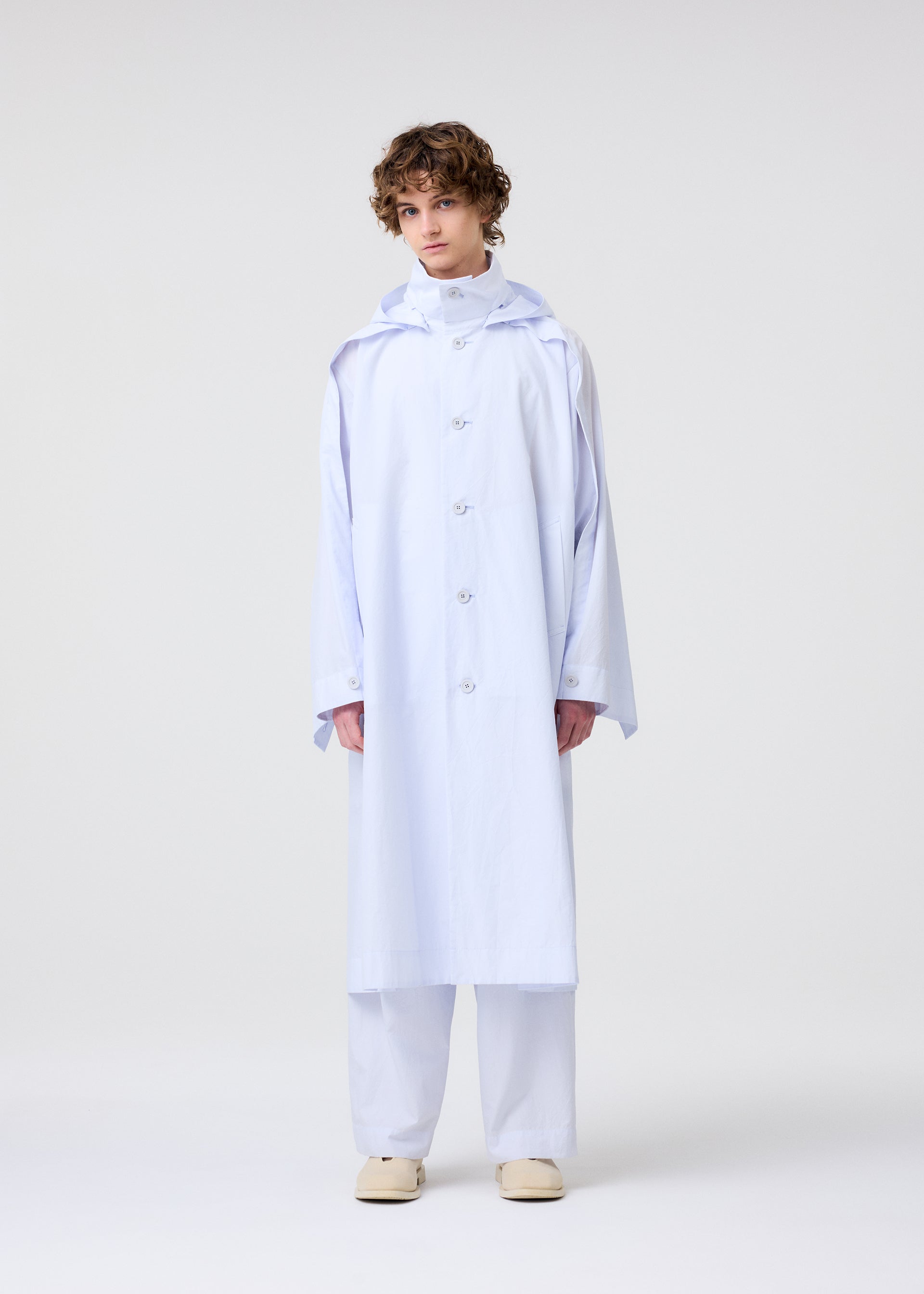 A model wears the Homme Plisse Issey Miyake FRESHEN coat.