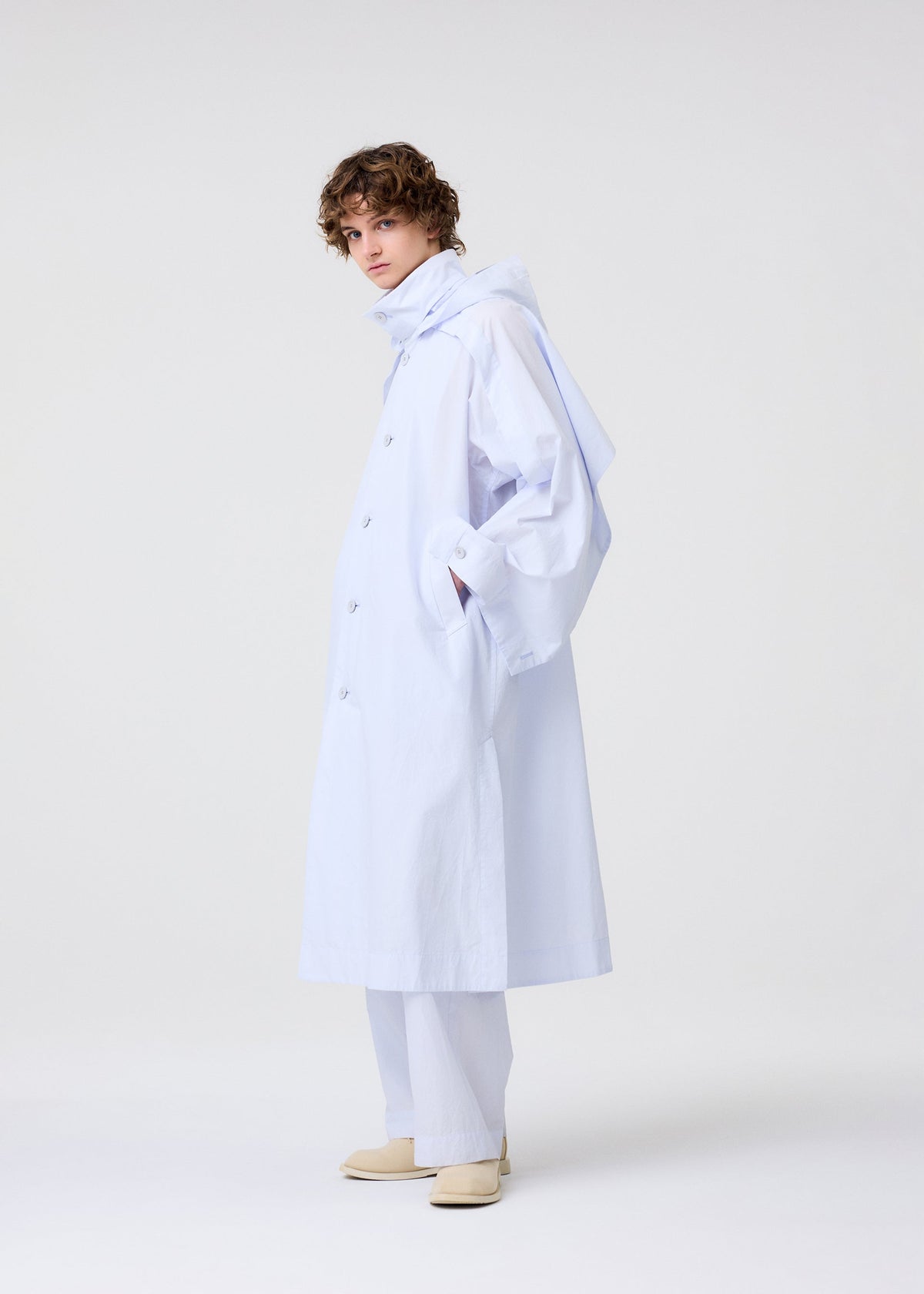 A model wears the Homme Plisse Issey Miyake FRESHEN coat.
