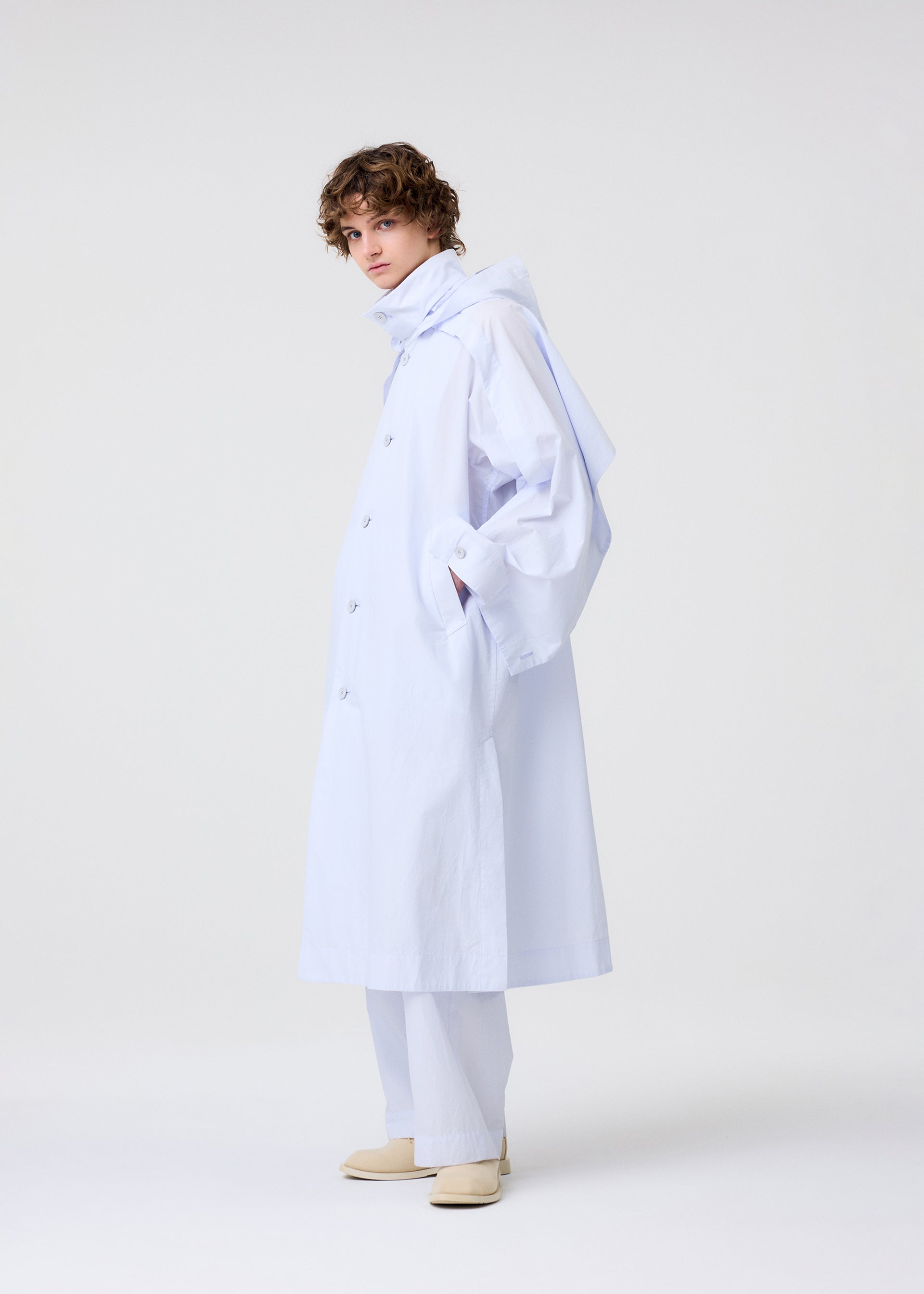 A model wears the Homme Plisse Issey Miyake FRESHEN coat.